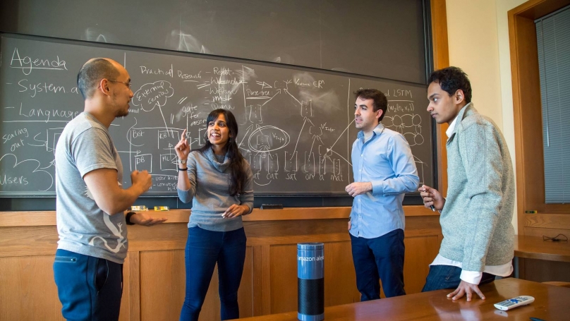 Team members, from left, Niranjani Prasad, Ari Seff, Karan Singh and Daniel Suo work on the project in the computer science building.