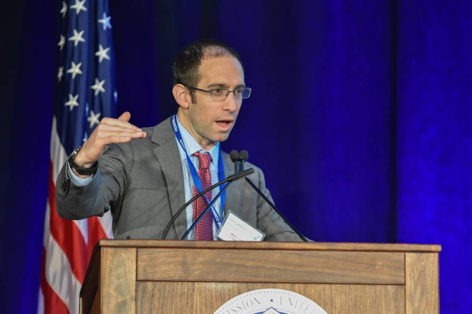 Nick Feamster speaking at a podium at the Federal Trade Commission.