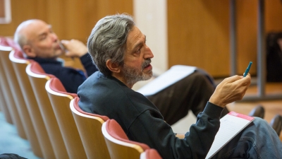 Avi Wigderson sitting in a classroom