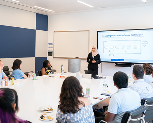 student presenting at an REU